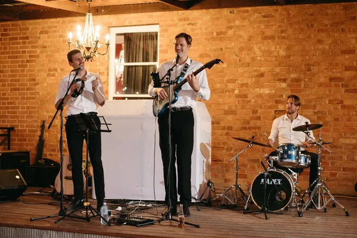 Jem Pryse performing with a full band