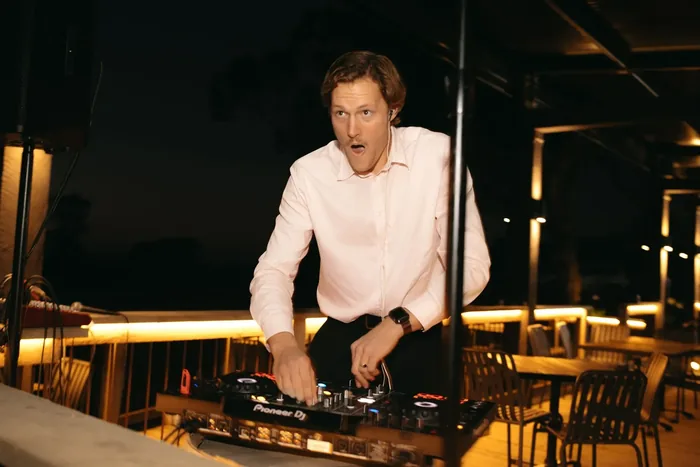 Jem Pryse DJing at a wedding reception at night