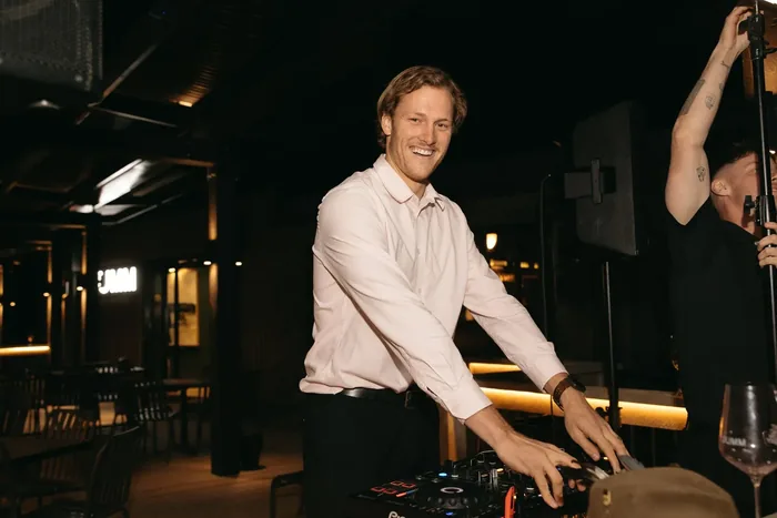 Jem Pryse DJing at an event at night