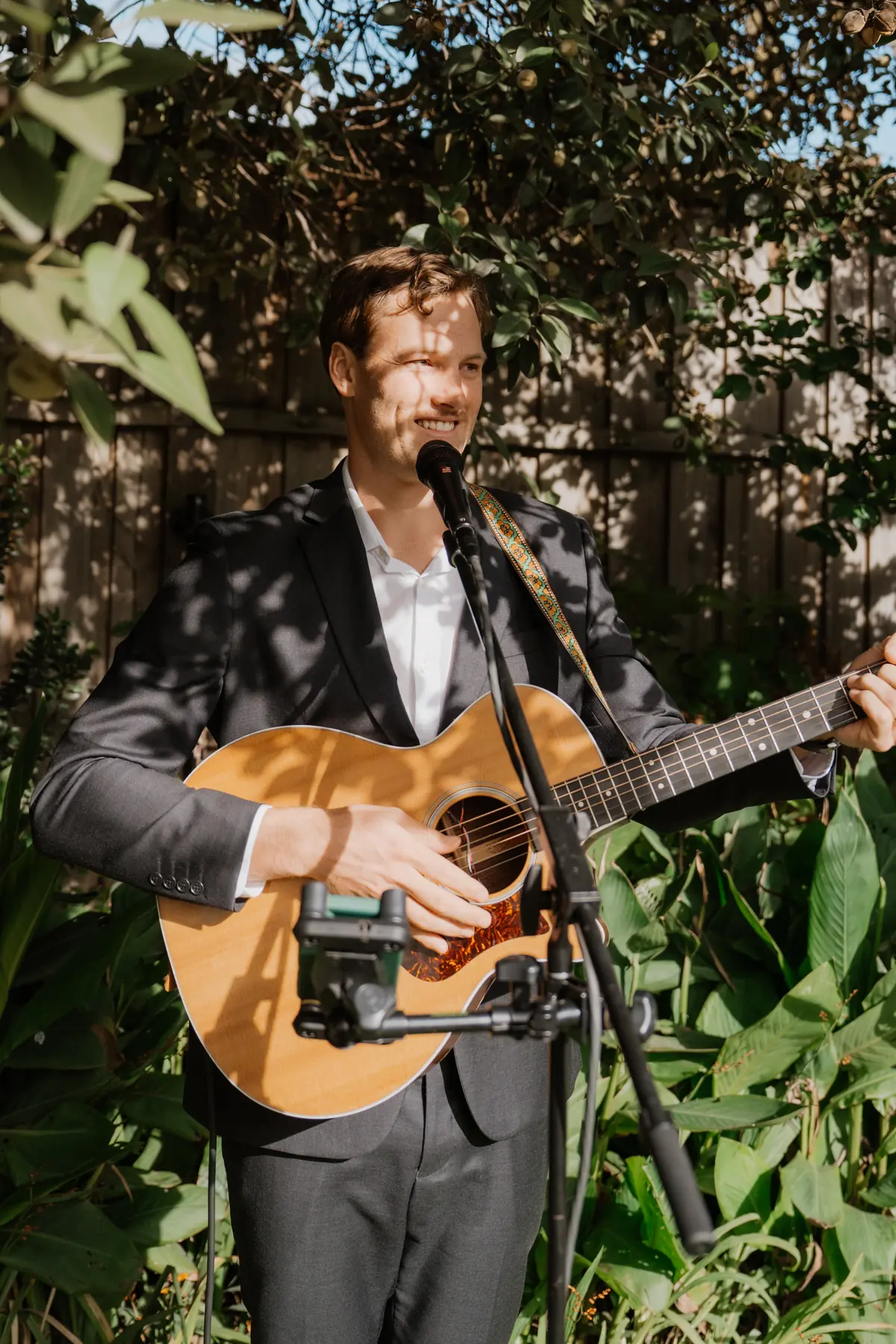 Jem Pryse playing surrounded by greenery
