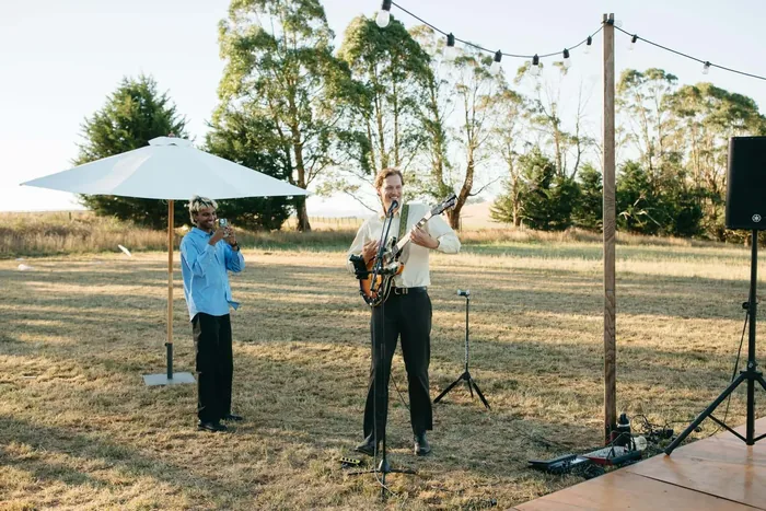 Jem Pryse performing outdoors at a wedding