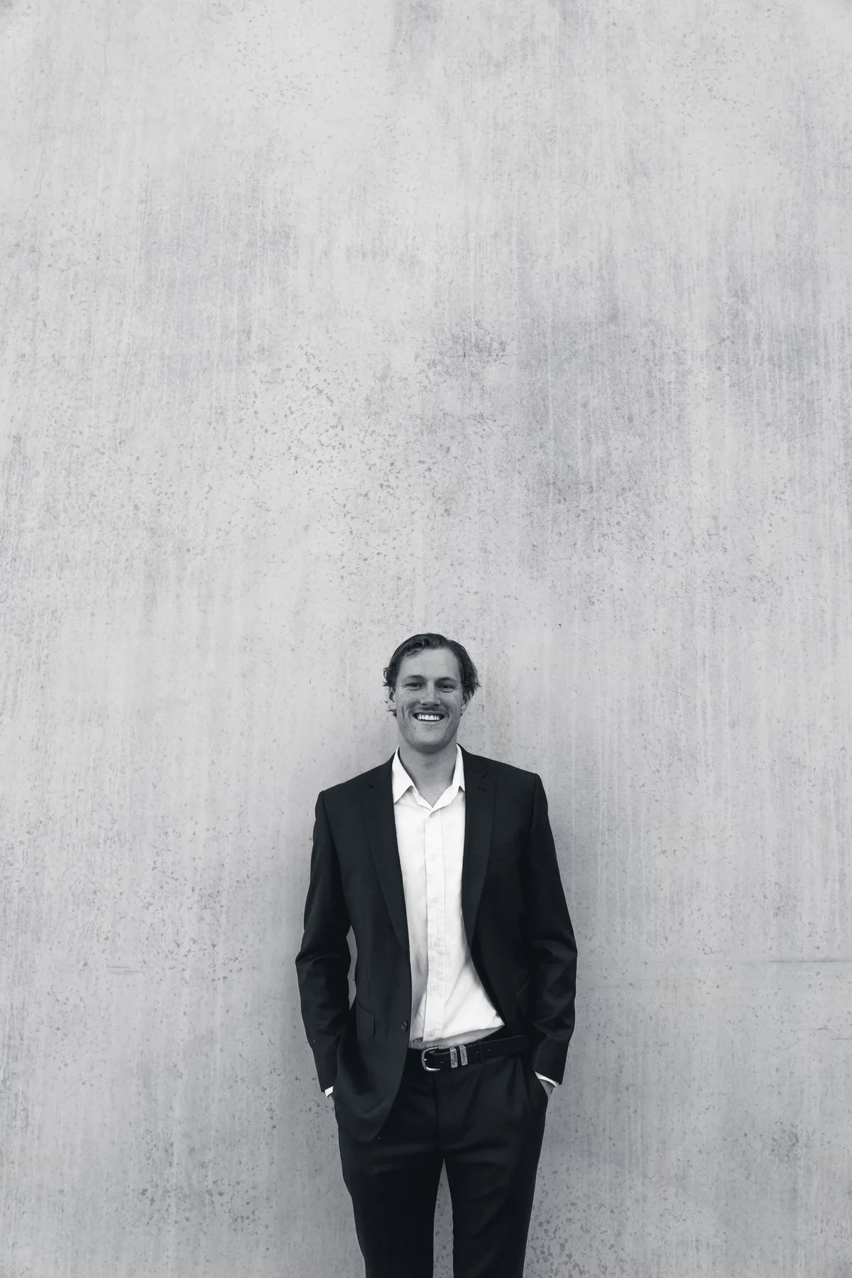 Black and white photo of Jem Pryse against a wall